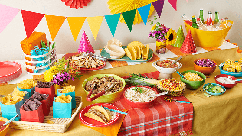 taco bar buffet : assorted taco ingredients displayed for self service