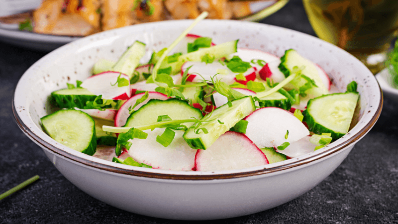 crunchy cucumber and radish salad served in a bowl