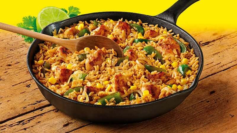 extra mild super tasty one pan rice meal placed on wooden board